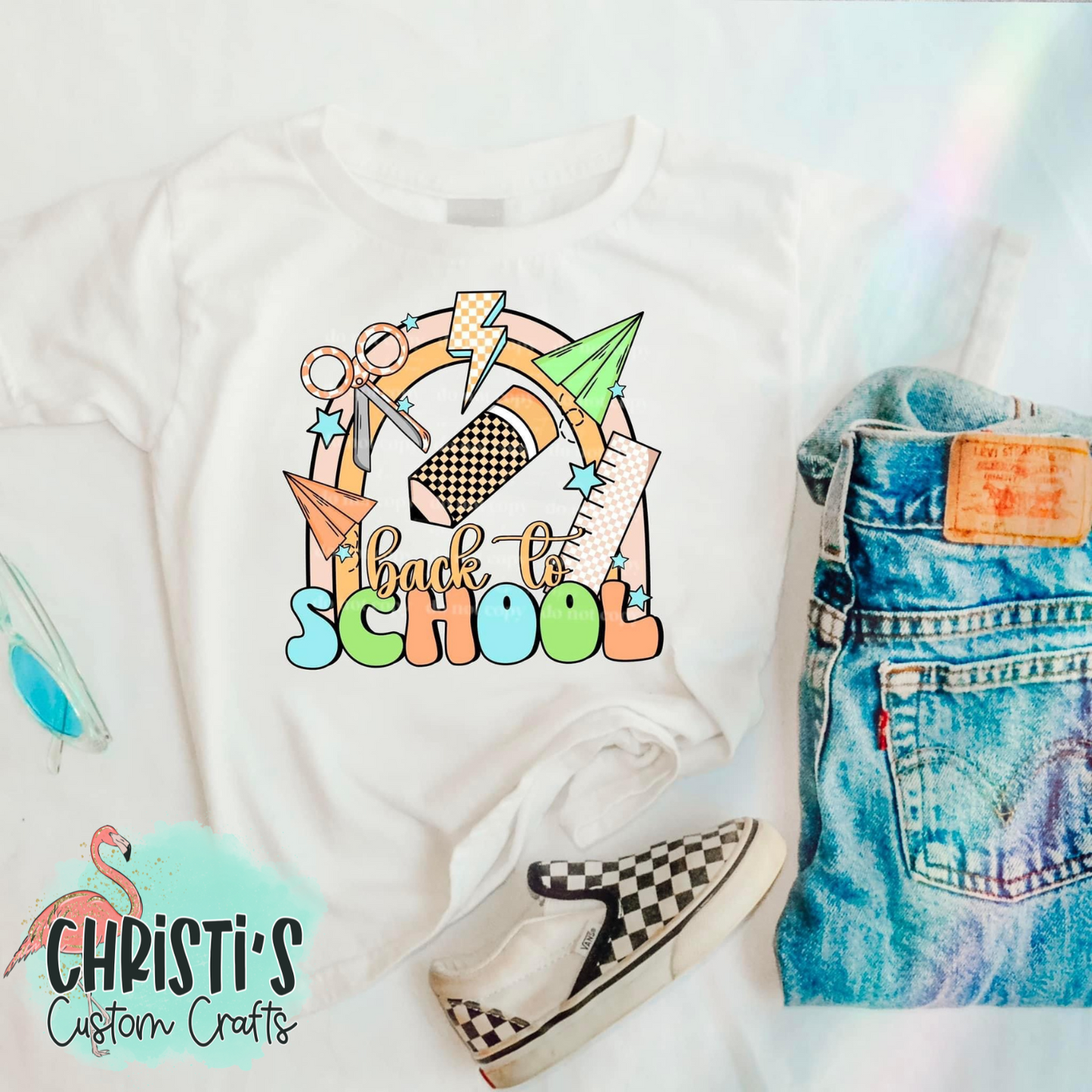 Pastel Back to School Supplies on rainbow