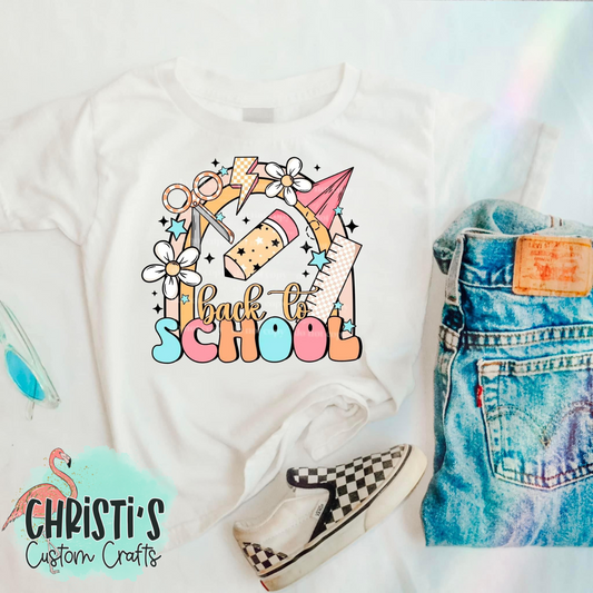 Pastel Back to School Supplies on rainbow