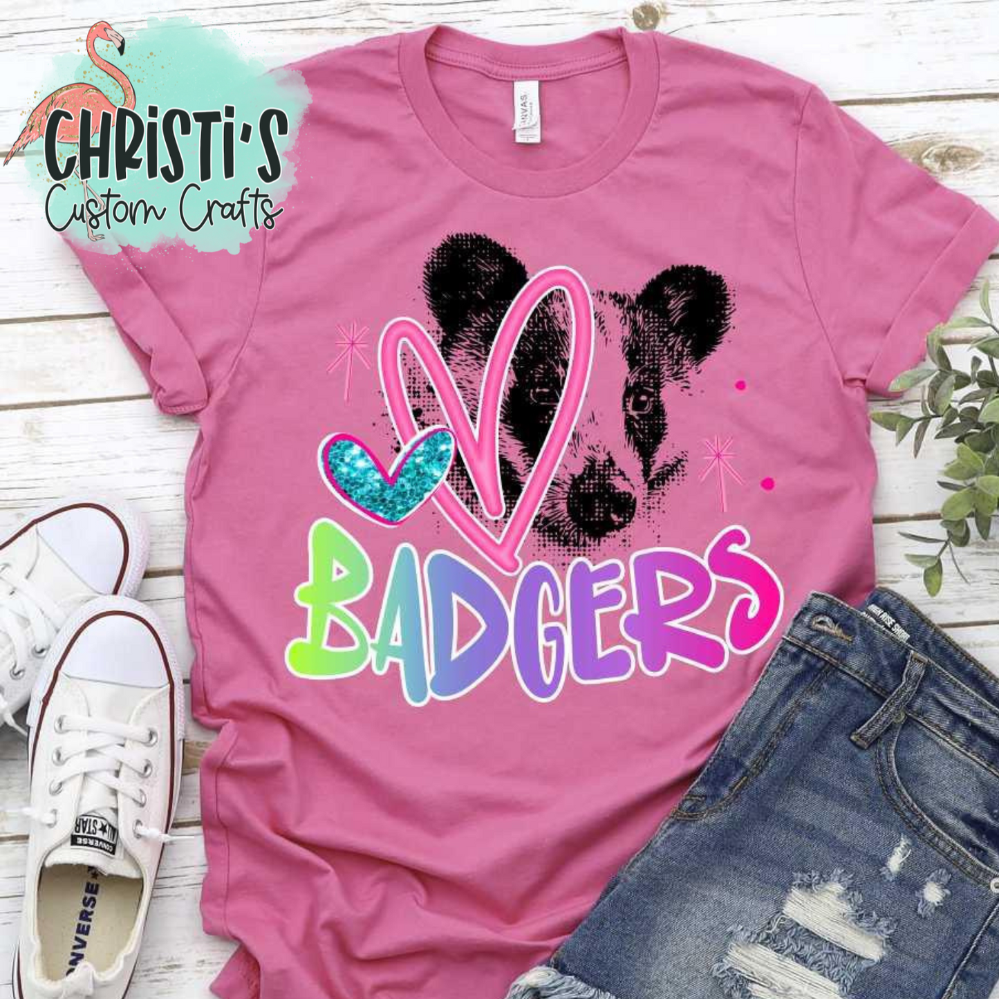 Black Dot Mascot with Rainbow Mascot Name and Pink Heart