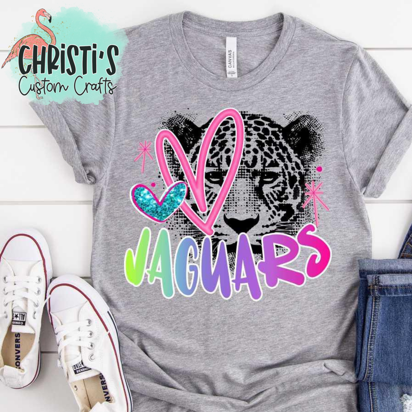 Black Dot Mascot with Rainbow Mascot Name and Pink Heart